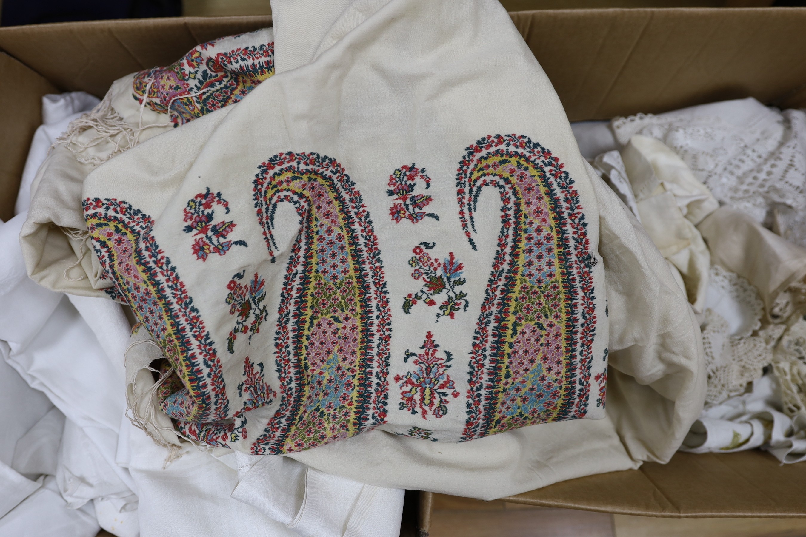 A 19th century Norwich shawl, together with mixed 20th century damask and crochet edged table cloths and linens